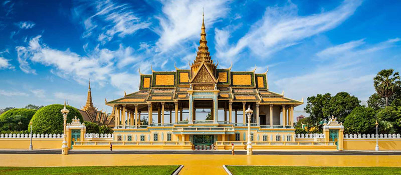 Golden spires of the Royal Palace against a blue Phnom Penh sky