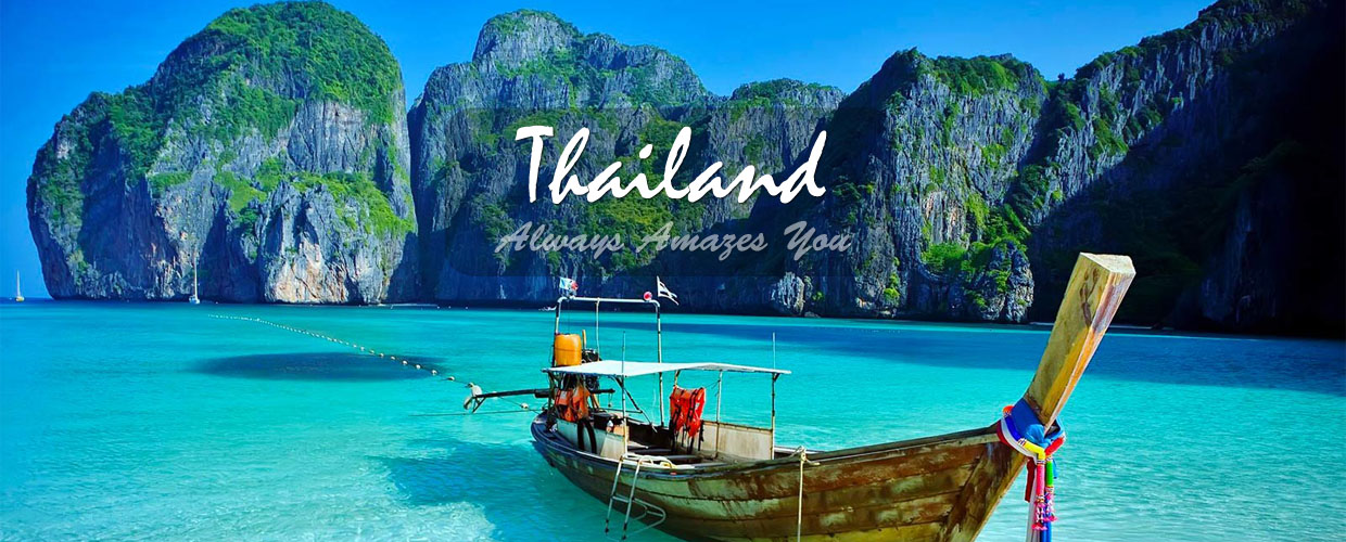 Longtail boat on turquoise water among limestone karsts in Southeast Asia