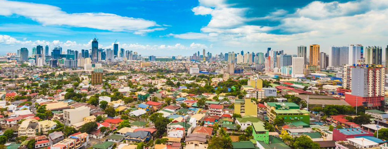 Manila skyline along Manila Bay at sunset